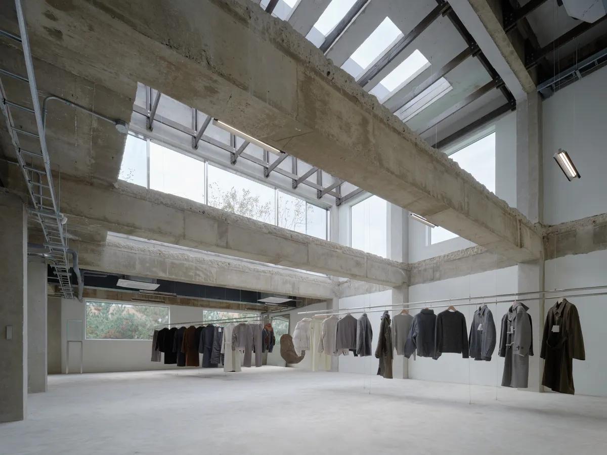 COOR Seongsu store contemporary fashion displays in exposed concrete space
