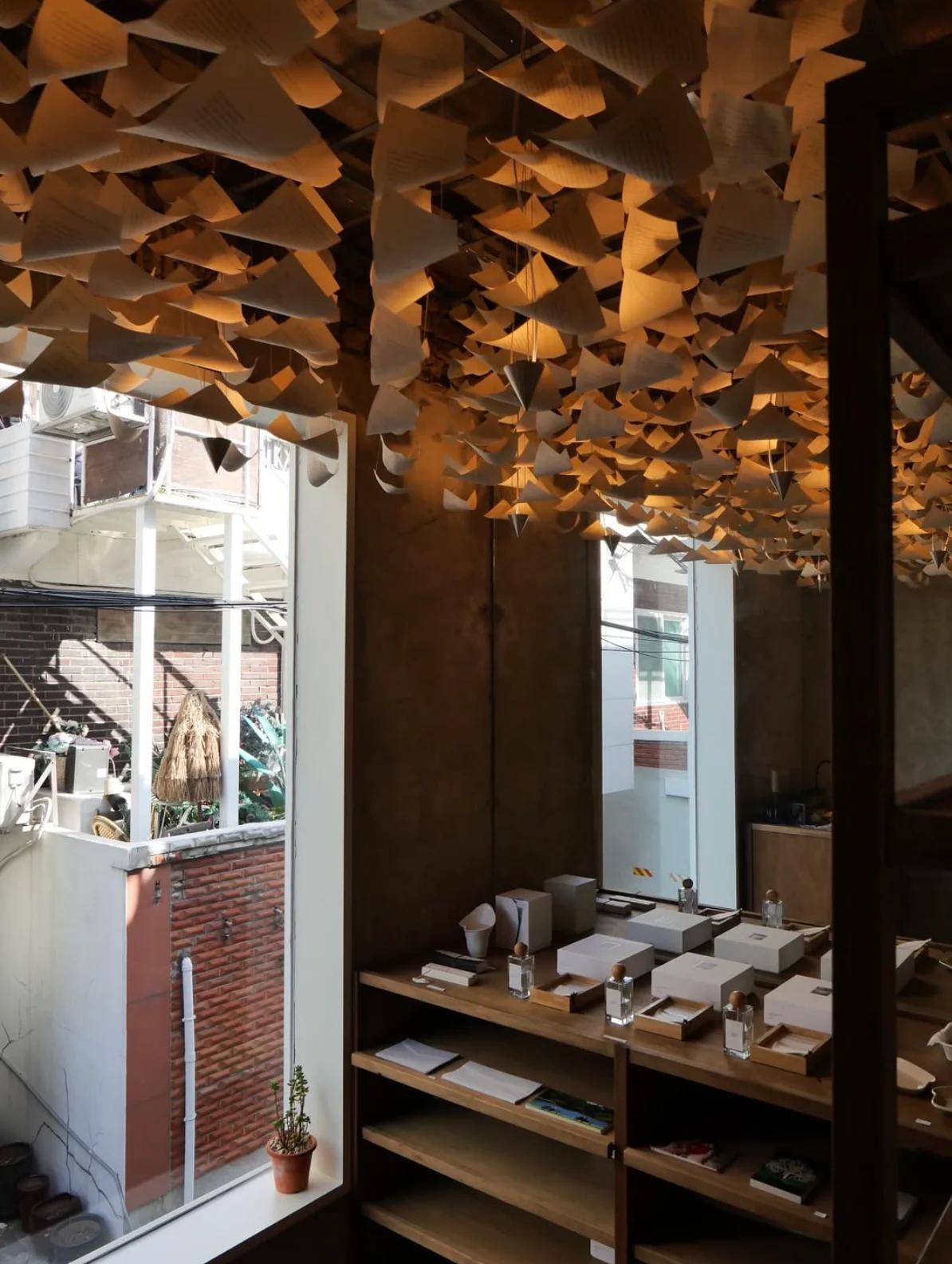 Hearts House interior - warm wood-tone seating area