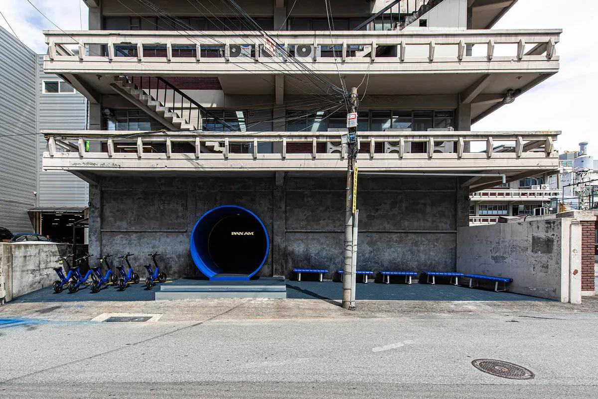 Pan Am Seongsu flagship store interior with futuristic steel and glass floor design